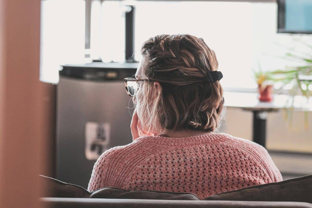 person sitting on couch