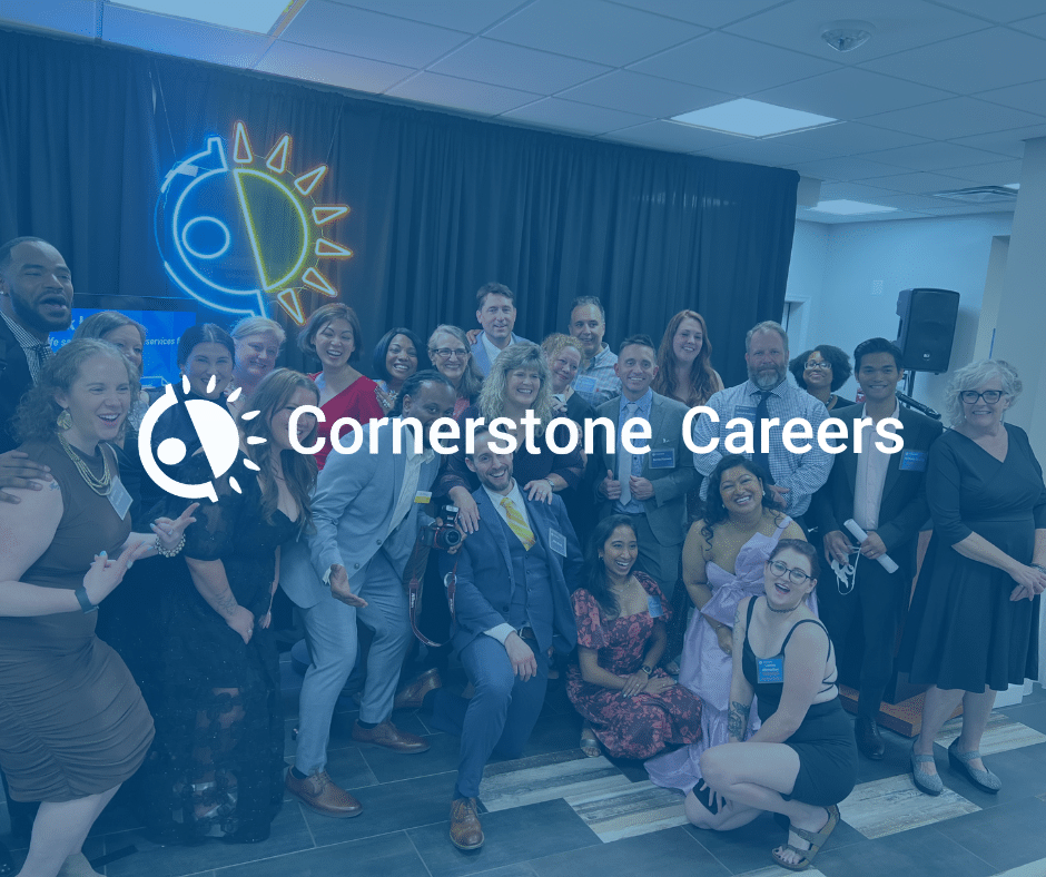 Over 20 of Cornerstone's staff posing and smiling for a group photo with a text overlay that says Cornerstone Careers.